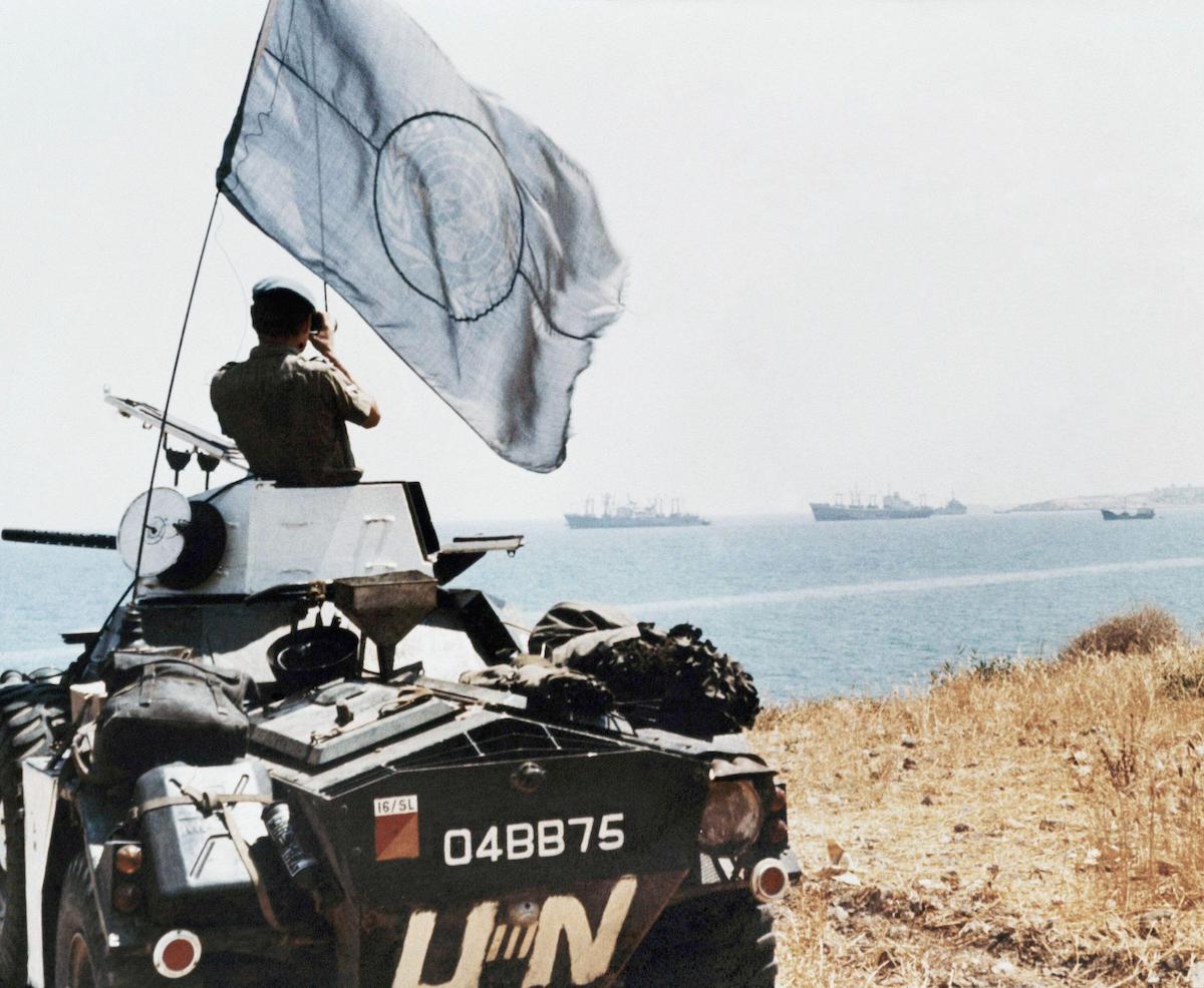 A United Nations trooper observes Turkish ship movements near Karavas, Cyprus, 4 August 1974. Associated Press/Alamy Stock Photo. A United Nations trooper observes Turkish ship movements near Karavas, Cyprus, 4 August 1974. Associated Press/Alamy Stock Photo.