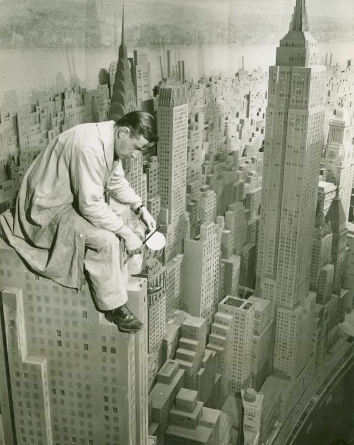 A painter at work on the 4,000-building Edison – City of Light diorama at the New York World’s Fair, 1940. New York Public Library. Public Domain. A painter at work on the 4,000-building Edison – City of Light diorama at the New York World’s Fair, 1940. New York Public Library. Public Domain.
