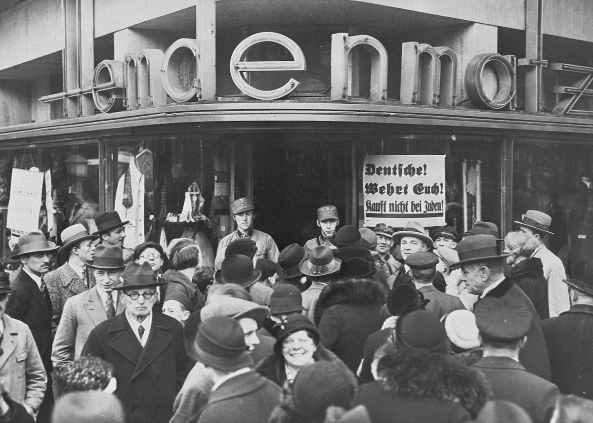 A crowd of Germans outside of a Jewish-owned department store in Berlin on the first day of the Nazi boycott of Jewish-owned businesses, 1 April 1933. United States Holocaust Memorial Museum, courtesy of National Archives. Public Domain. A crowd of Germans outside of a Jewish-owned department store in Berlin on the first day of the Nazi boycott of Jewish-owned businesses, 1 April 1933. United States Holocaust Memorial Museum, courtesy of National Archives. Public Domain.